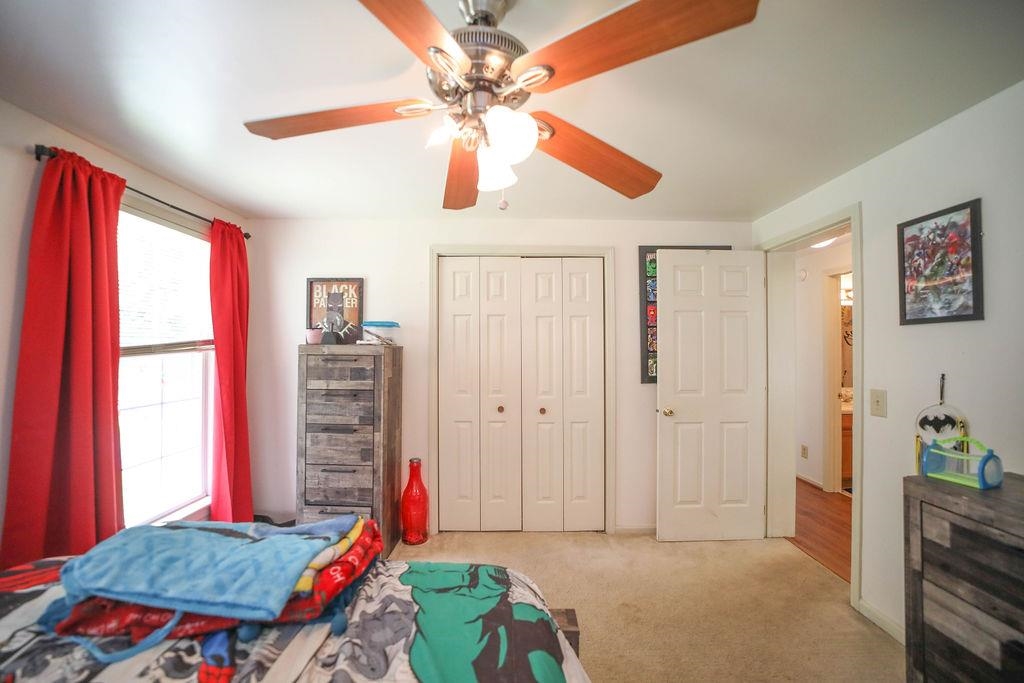 79 Cattle Scales Road Waynesboro, VA 22980 - Photo 24 of 39 a bedroom with a bed and a chandelier