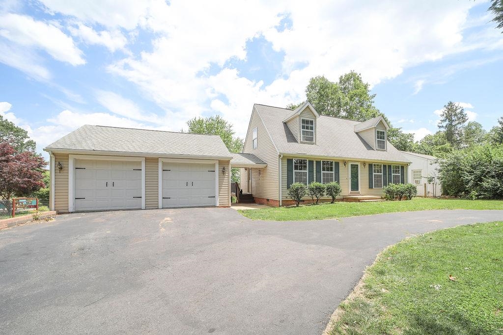 79 Cattle Scales Road Waynesboro, VA 22980 - Photo 6 of 39 a front view of a house with a yard and garage