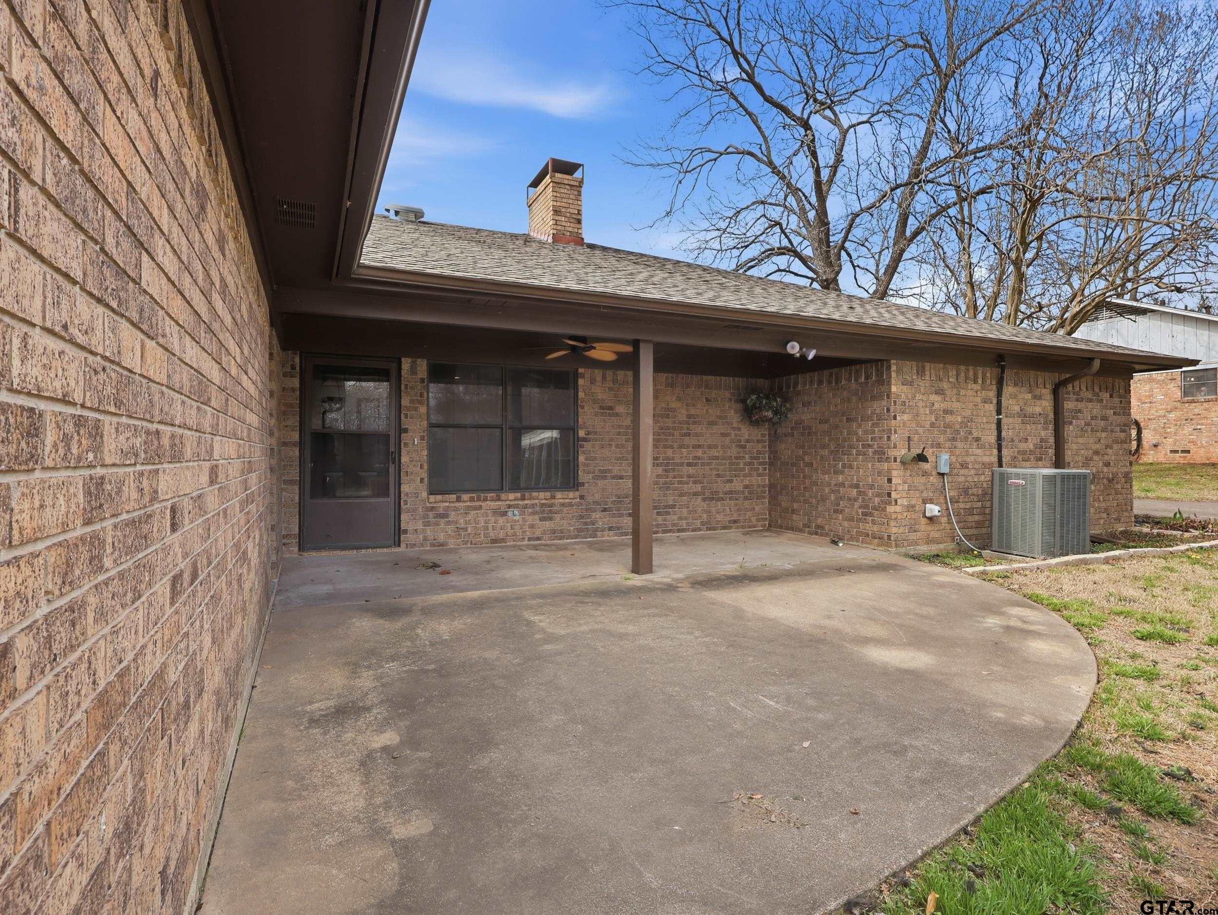 231 Quitman Street Pittsburg, TX 75686 - Photo 11 of 31 a front view of a house with garage