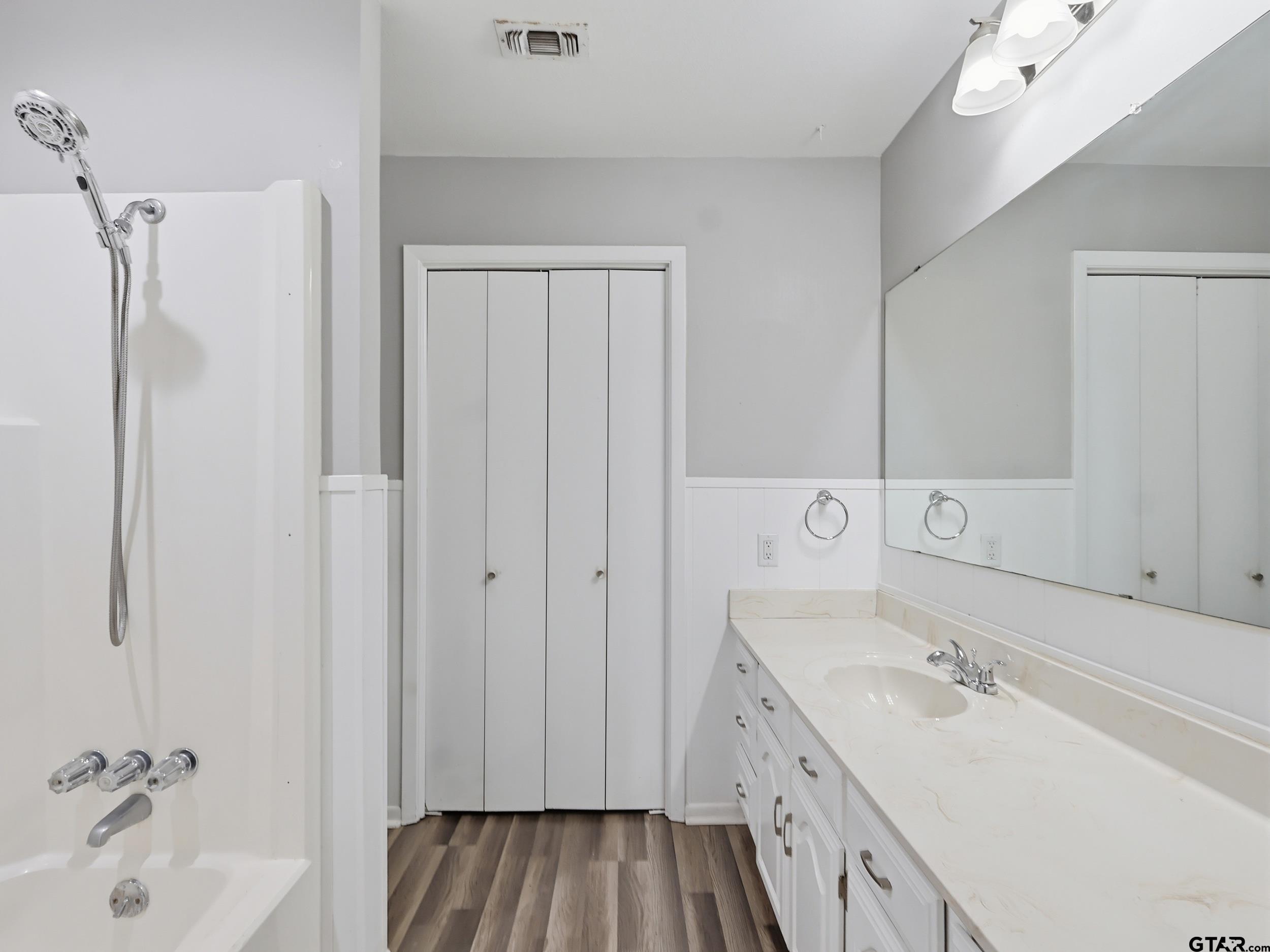 231 Quitman Street Pittsburg, TX 75686 - Photo 20 of 31 a bathroom with a sink and a tub