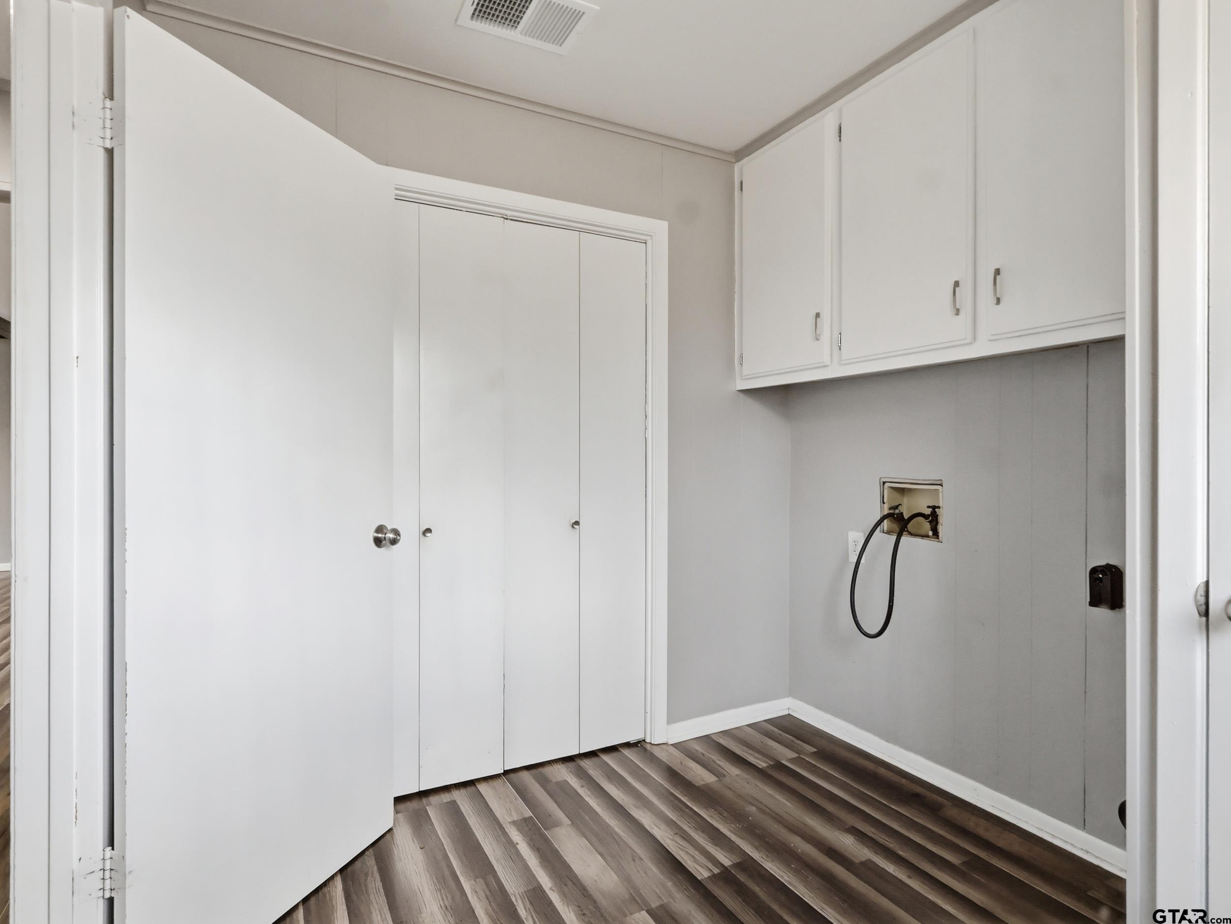231 Quitman Street Pittsburg, TX 75686 - Photo 22 of 31 a view of a room with racks on the wall