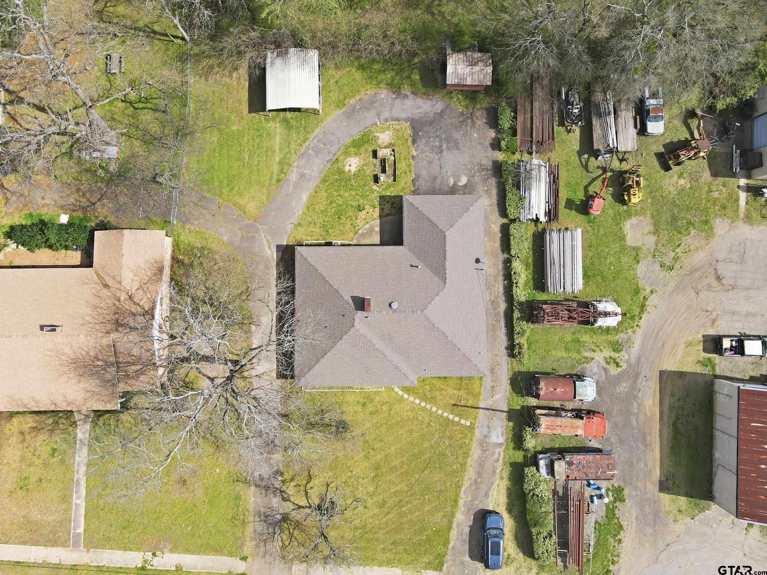 231 Quitman Street Pittsburg, TX 75686 - Photo 30 of 31 an aerial view of residential houses with outdoor space