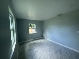 a kitchen with a sink a stove and cabinets