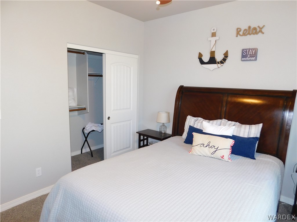 3370 South Ridge Avenue Bullhead City, AZ 86429 - Photo 45 of 56 a bedroom with a bed and a night stand