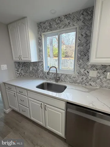 a kitchen with sink cabinets and window