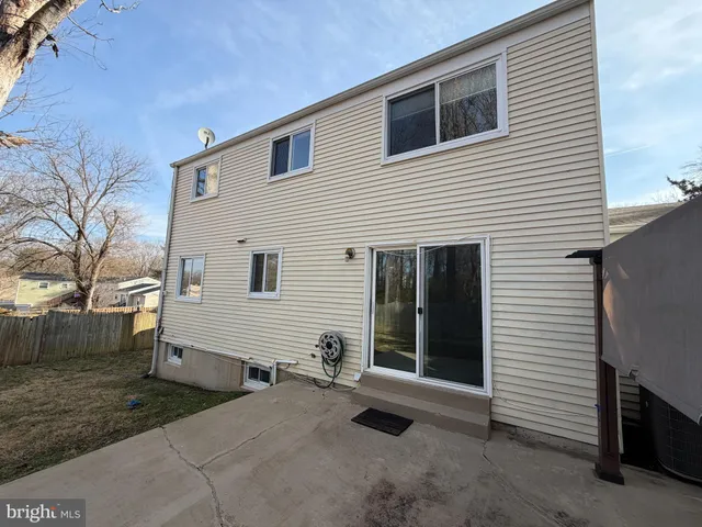 a view of a house with a yard and garage