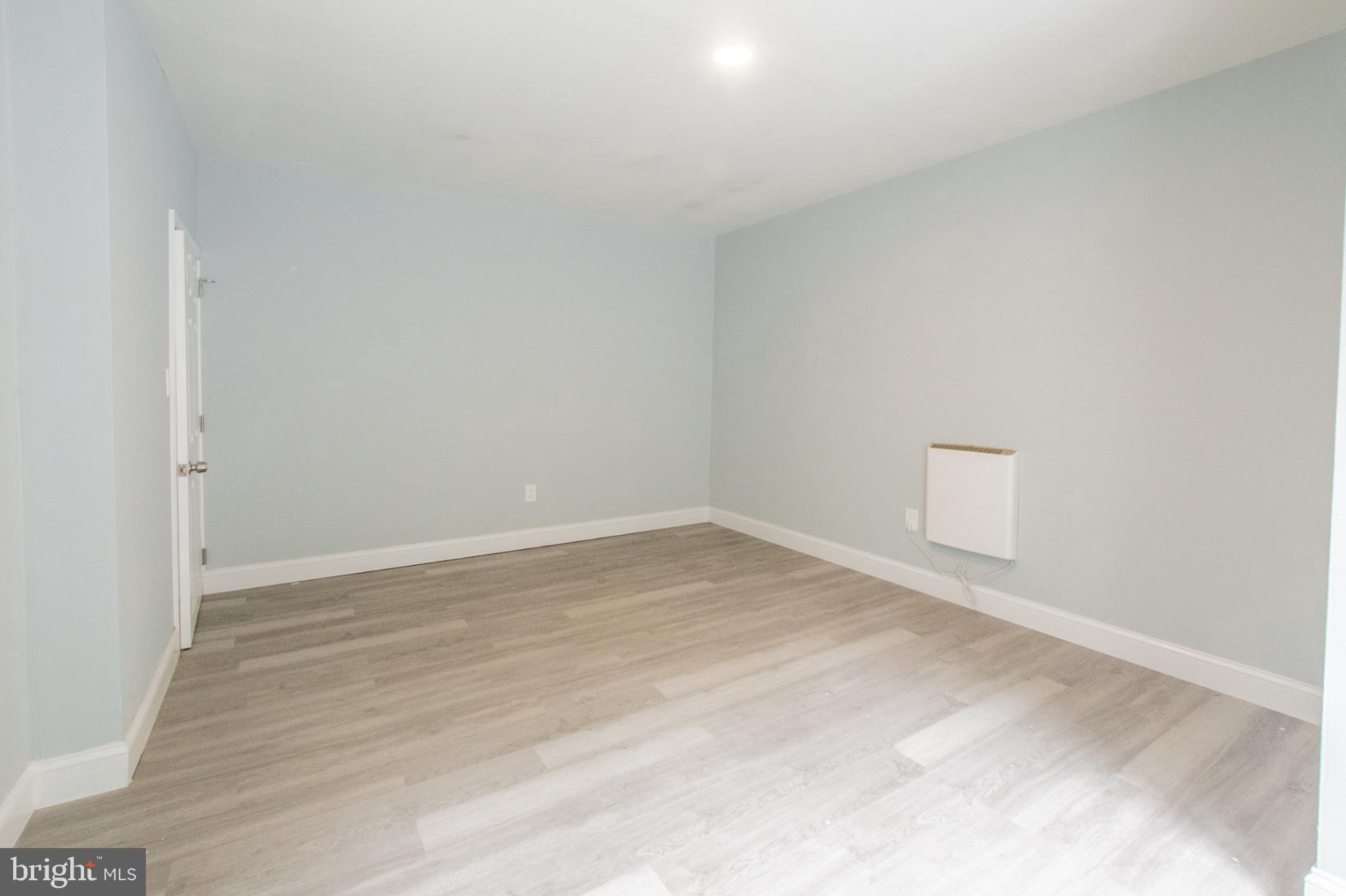 1425 South Manor Road Coatesville, PA 19320 - Photo 17 of 32 Spacious room with soft blue walls.
