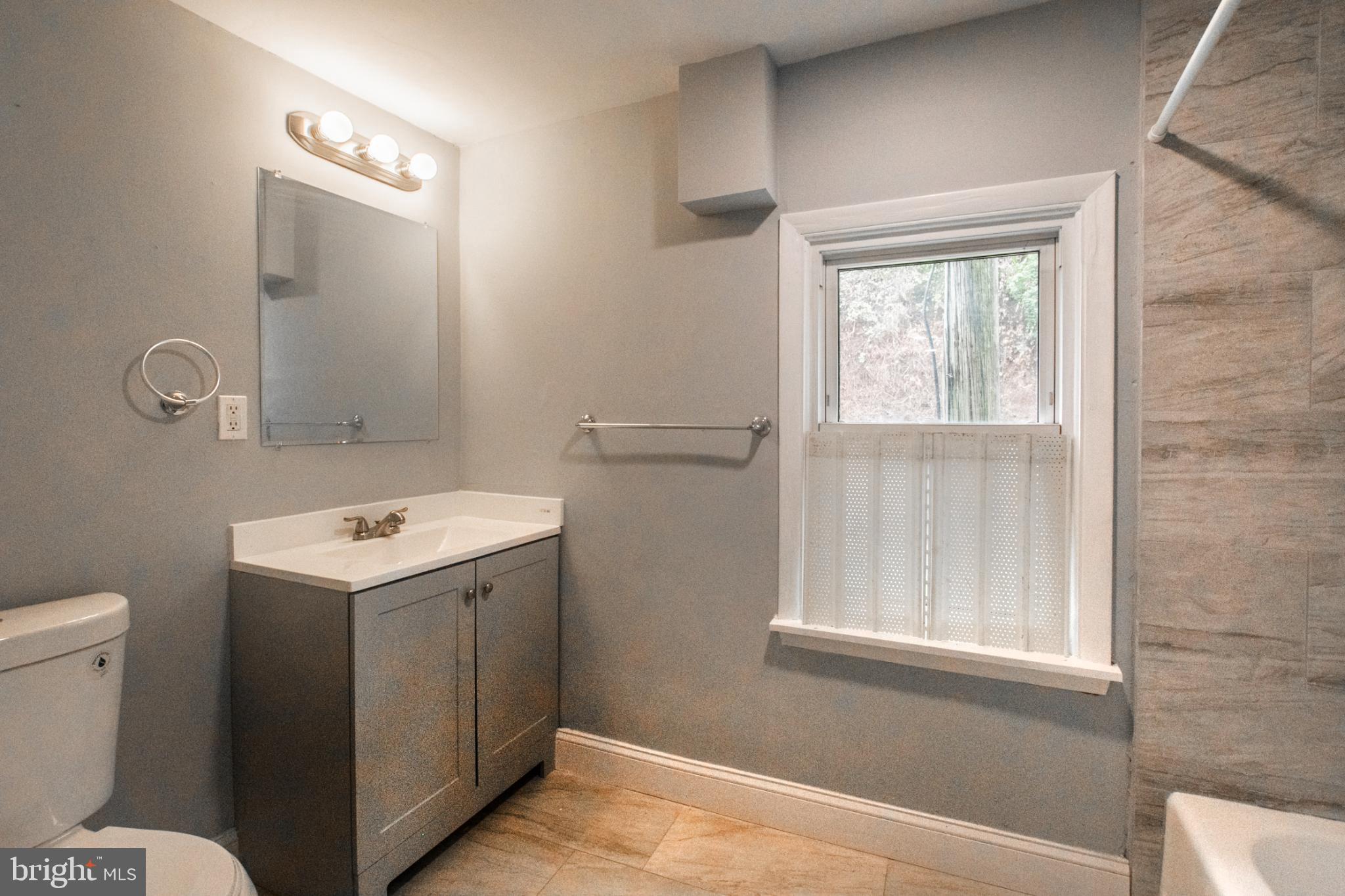 1425 South Manor Road Coatesville, PA 19320 - Photo 21 of 32 Modern bathroom with natural light.