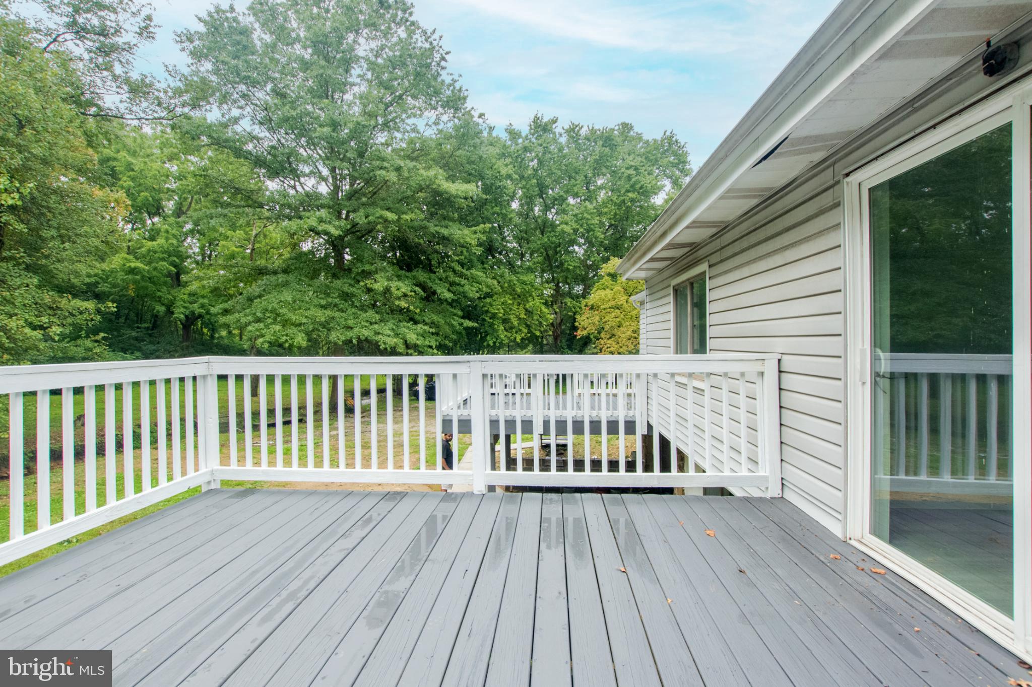 1425 South Manor Road Coatesville, PA 19320 - Photo 27 of 32 Serene deck overlooking lush greenery.