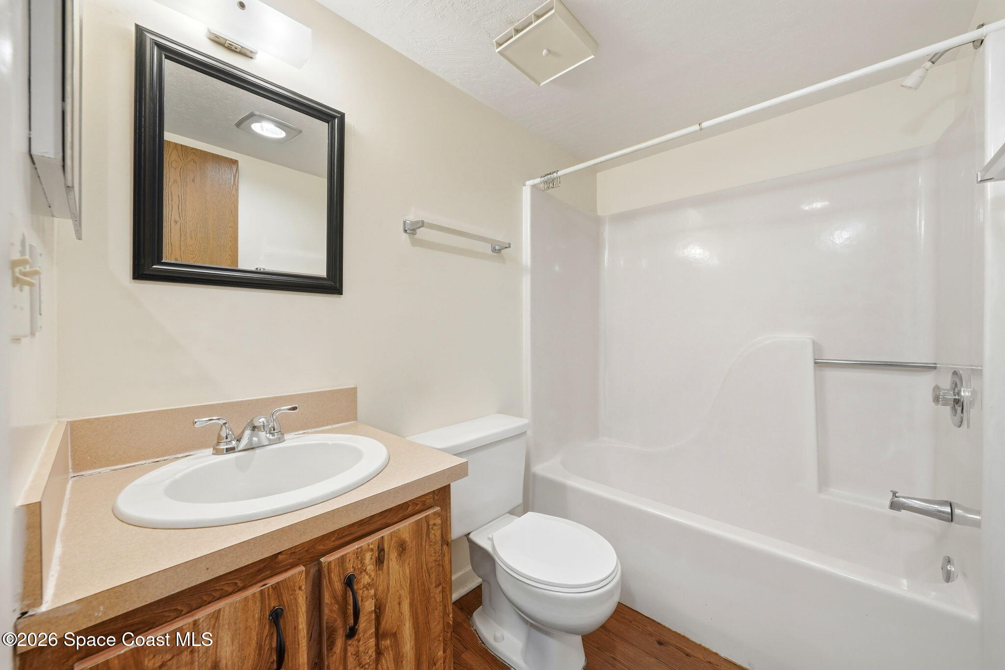 1702 University Lane, Unit 804 Cocoa, FL 32922 - Photo 12 of 25 a bathroom with a sink and a mirror