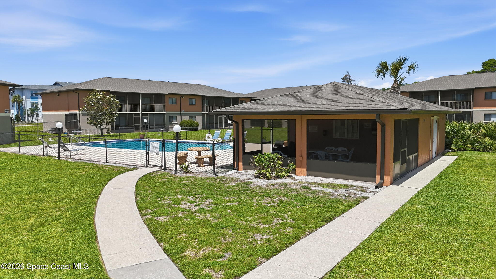 1702 University Lane, Unit 804 Cocoa, FL 32922 - Photo 23 of 25 a view of a house with a yard porch and sitting area