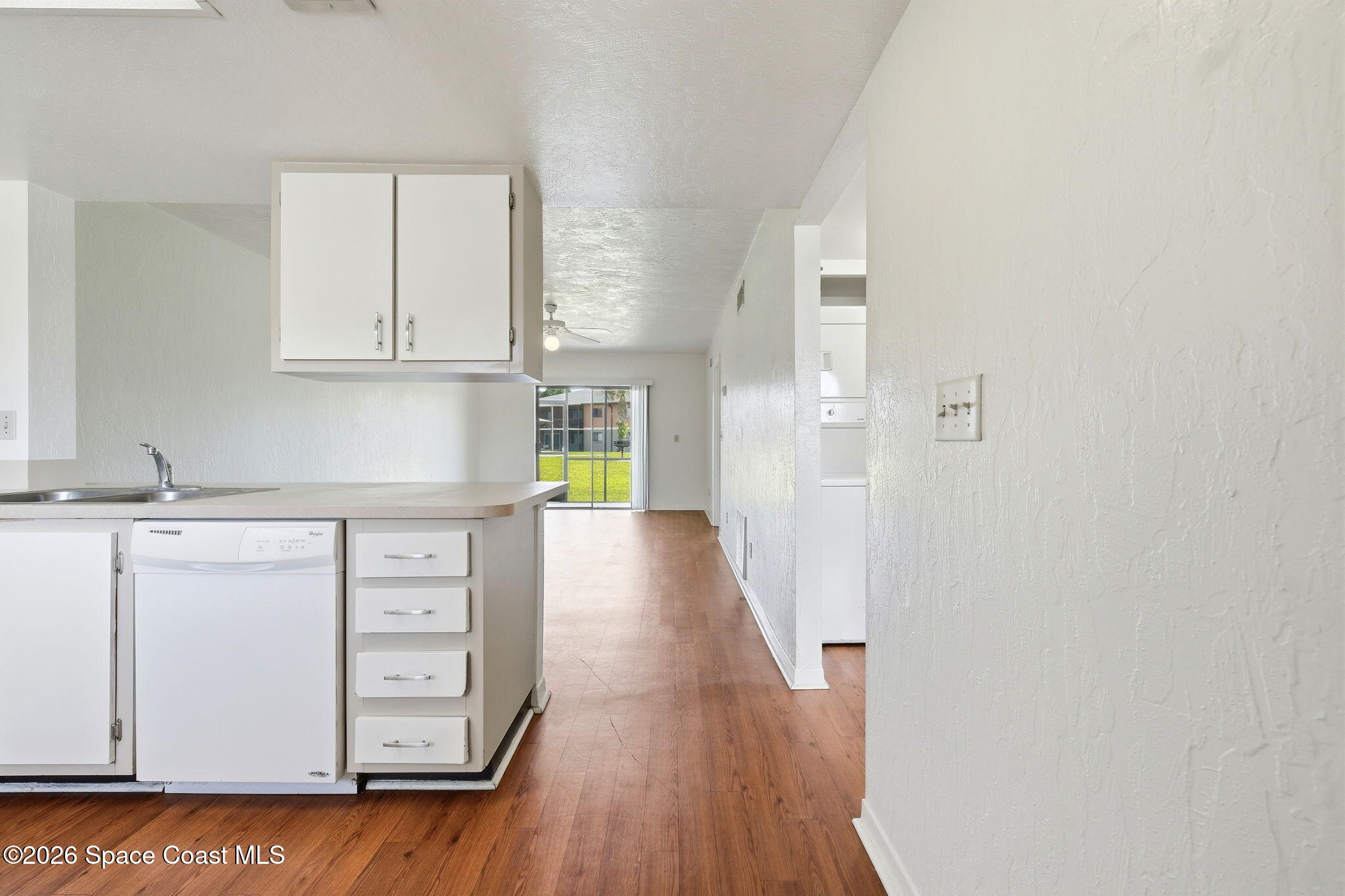 1702 University Lane, Unit 804 Cocoa, FL 32922 - Photo 3 of 25 a view of cabinets with wooden floor