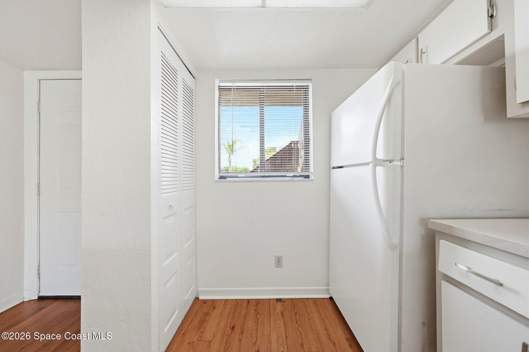 1702 University Lane, Unit 804 Cocoa, FL 32922 - Photo 6 of 25 a view of a hallway with wooden floor and entryway