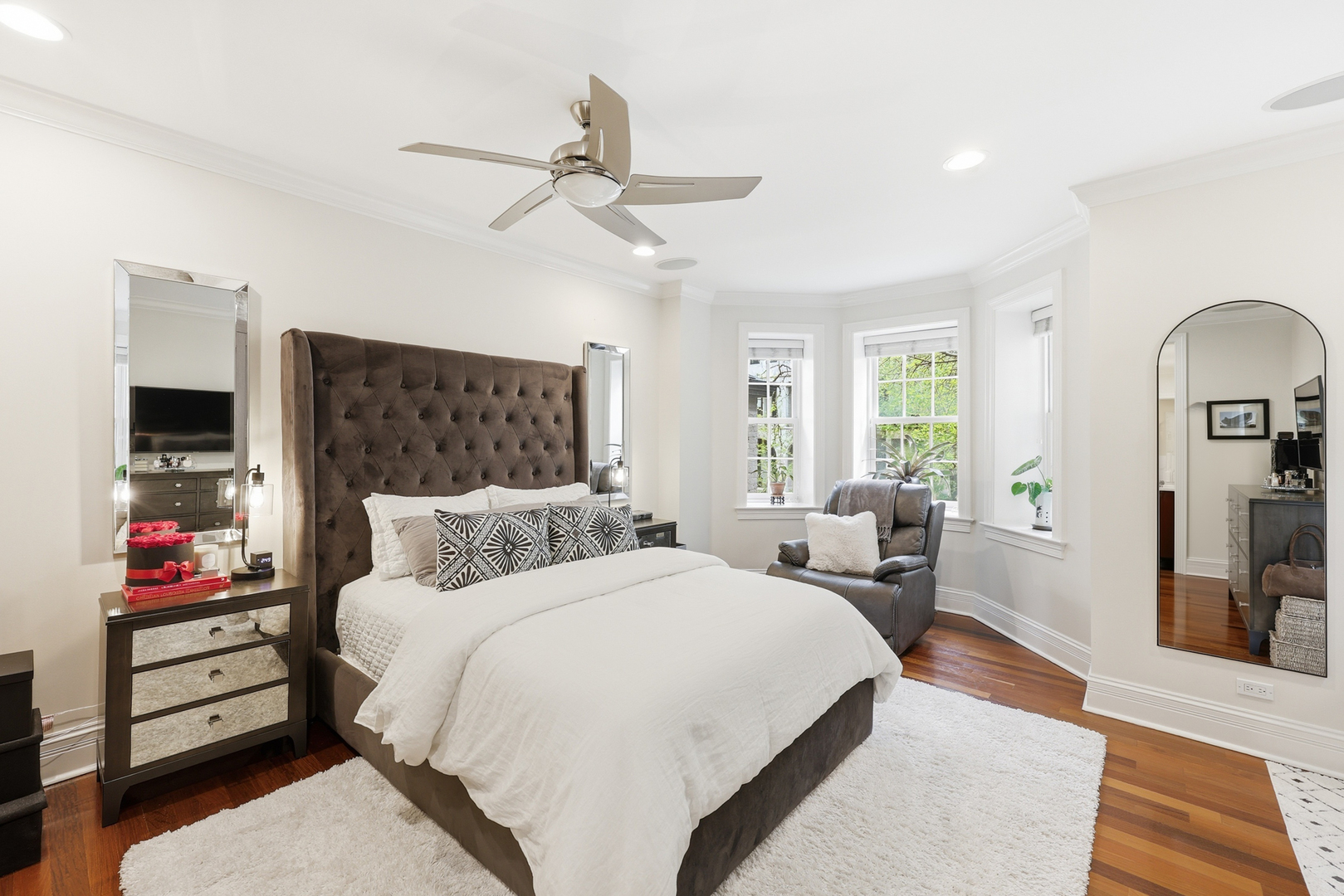 22 East Division Street, Unit 1 Chicago, IL 60610 - Photo 23 of 60 a bedroom with a large bed and a chandelier