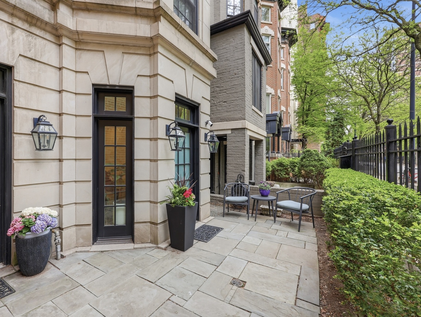 22 East Division Street, Unit 1 Chicago, IL 60610 - Photo 3 of 60 a view of a patio with a table and chairs and potted plants