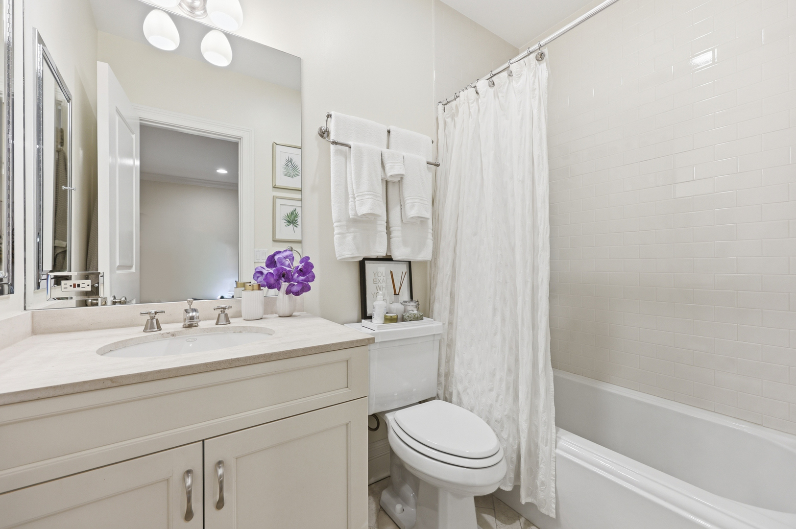 22 East Division Street, Unit 1 Chicago, IL 60610 - Photo 32 of 60 a bathroom with a sink toilet vanity and shower