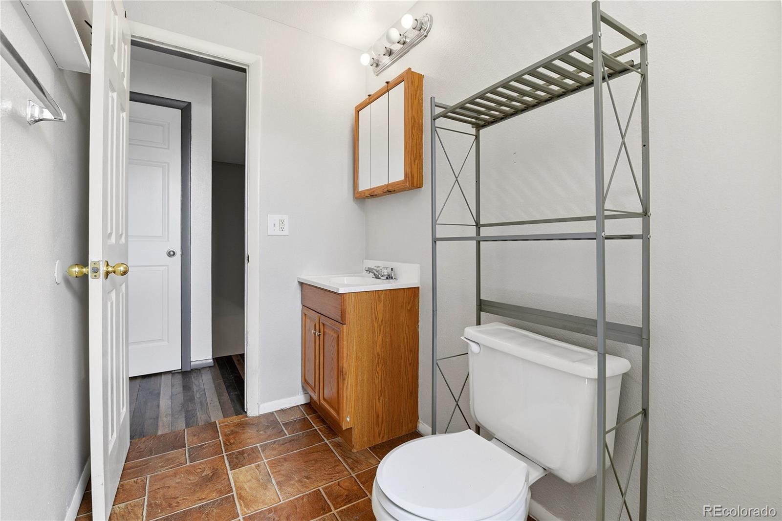 7461 Webster Street Arvada, CO 80003 - Photo 22 of 31 a bathroom with a toilet and a shower