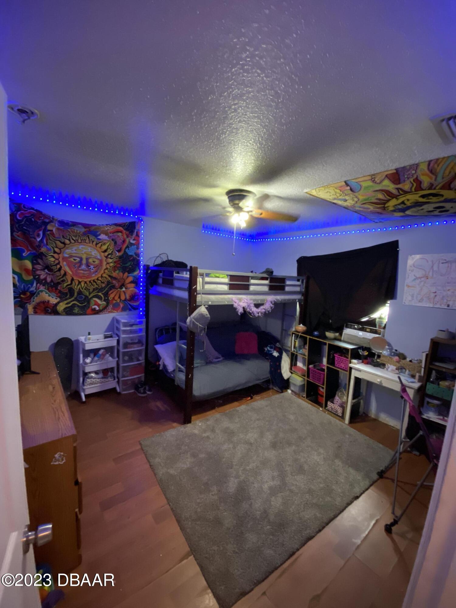 3315 Juniper Drive Edgewater, FL 32141 - Photo 11 of 20 a view of a room with gym equipment and a flat screen tv