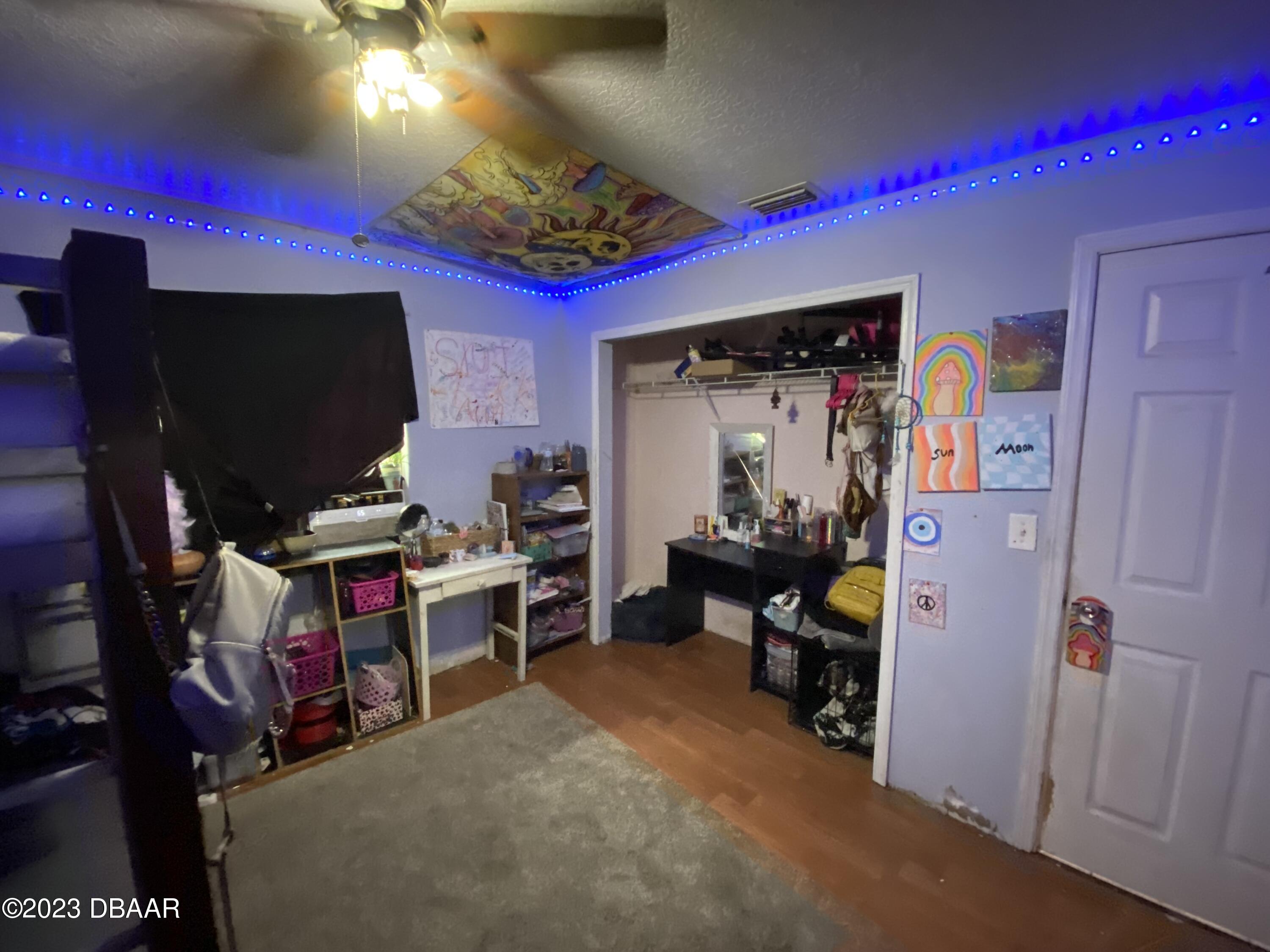 3315 Juniper Drive Edgewater, FL 32141 - Photo 12 of 20 a room with furniture and a flat screen tv