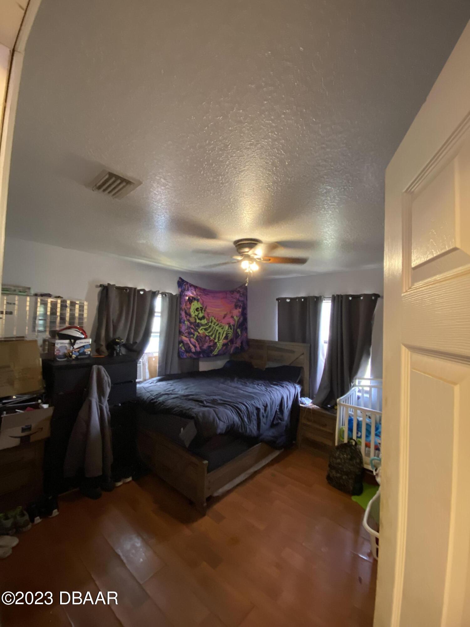 3315 Juniper Drive Edgewater, FL 32141 - Photo 13 of 20 a living room with furniture and a flat screen tv