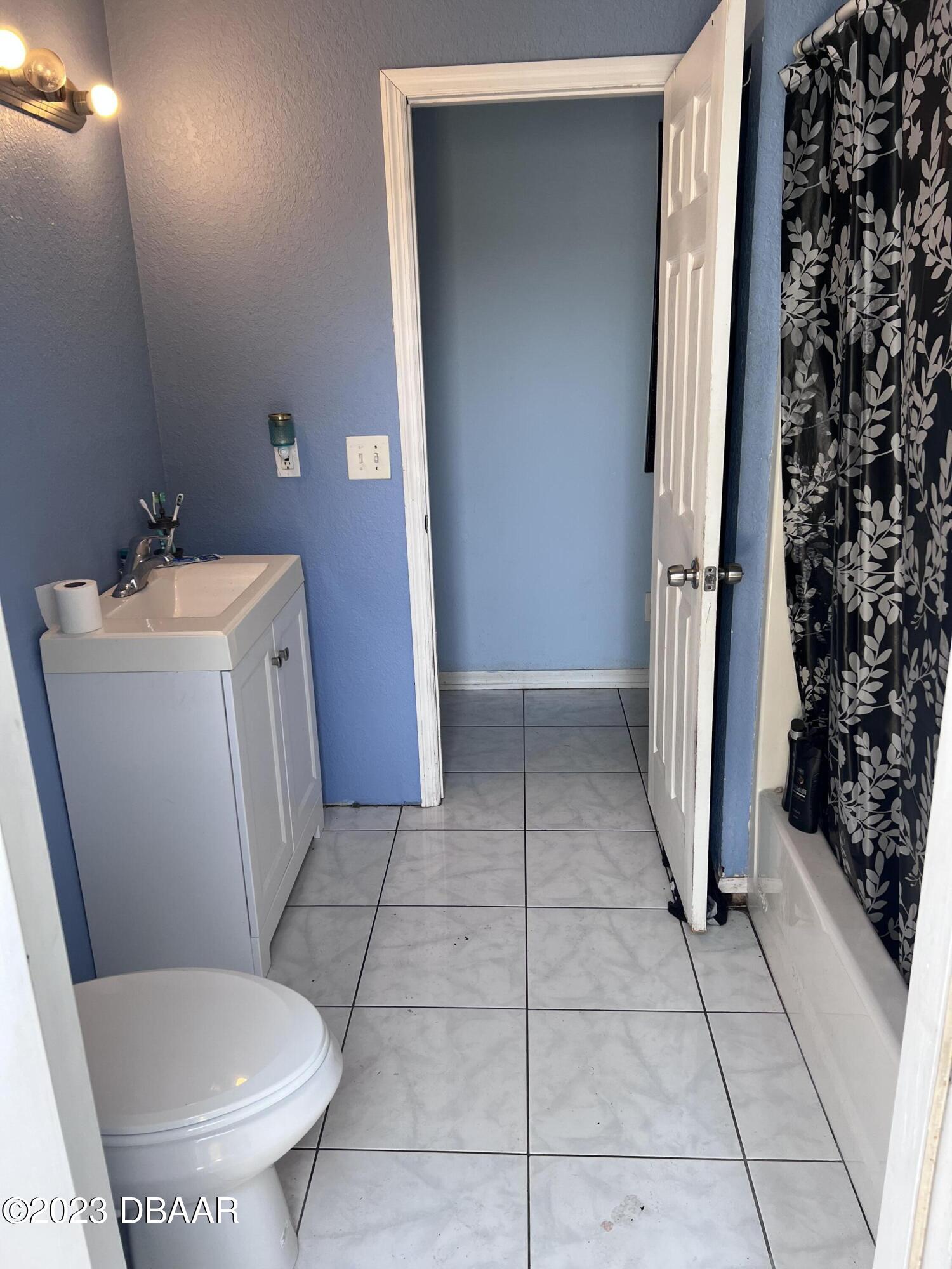 3315 Juniper Drive Edgewater, FL 32141 - Photo 14 of 20 a bathroom with a sink and toilet