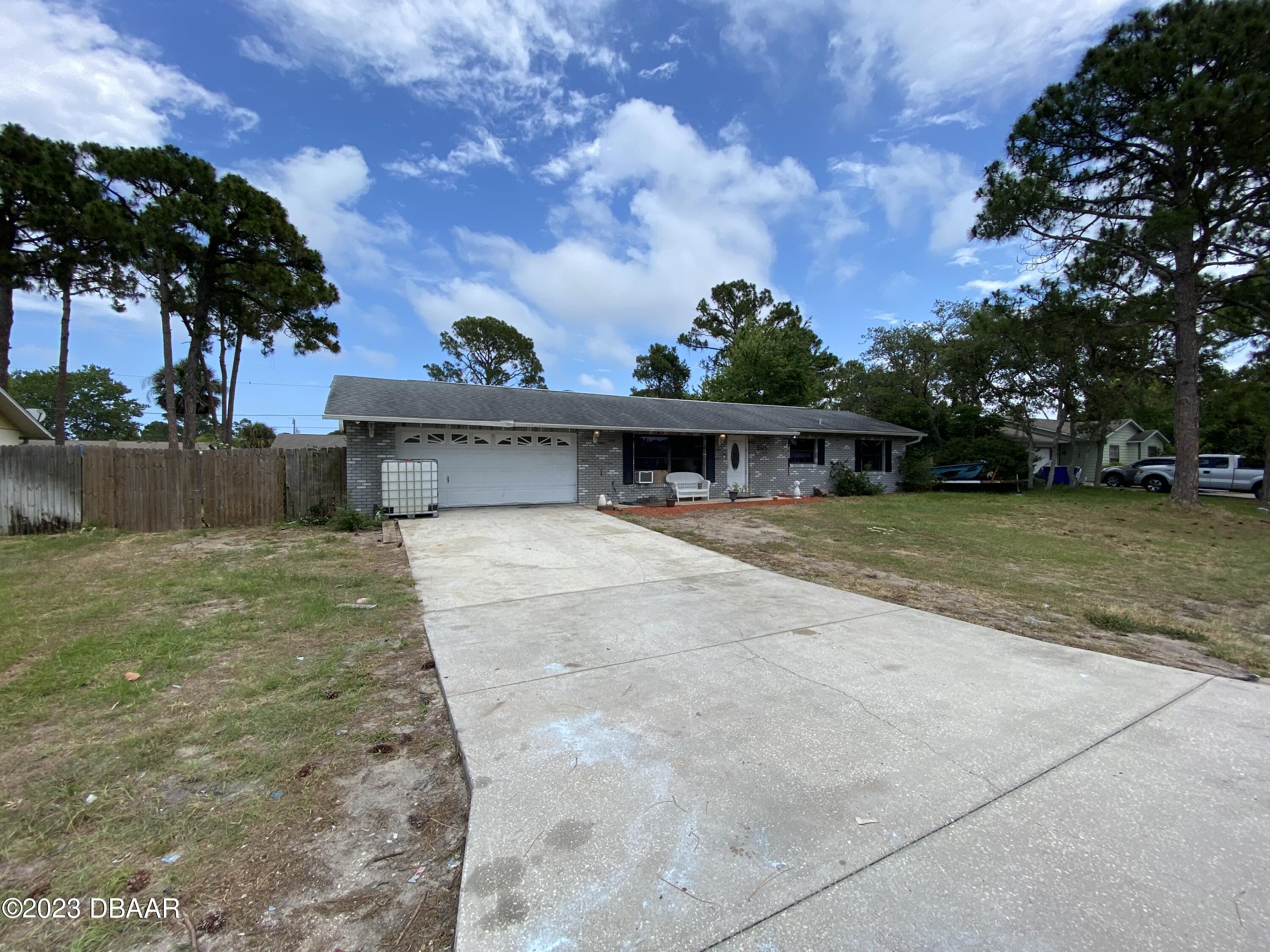 3315 Juniper Drive Edgewater, FL 32141 - Photo 2 of 20 front view of a house with a yard