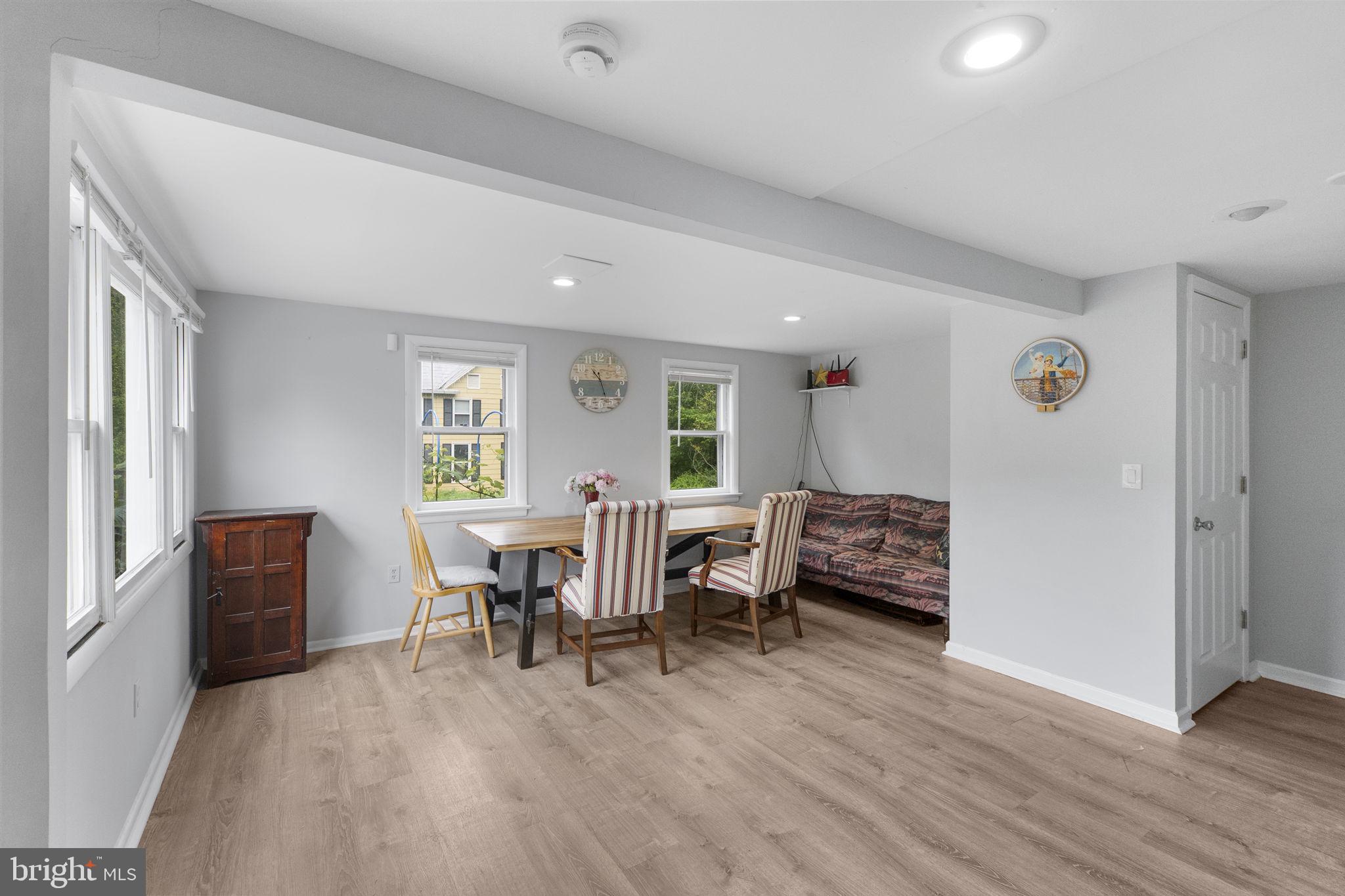 26001 Frederick Road Clarksburg, MD 20871 - Photo 12 of 46 a view of a livingroom with furniture and wooden floor