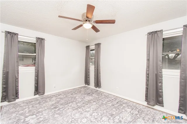 a view of a hallway to a bedroom