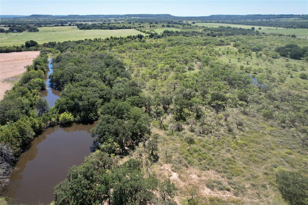 an aerial view of valley and lake