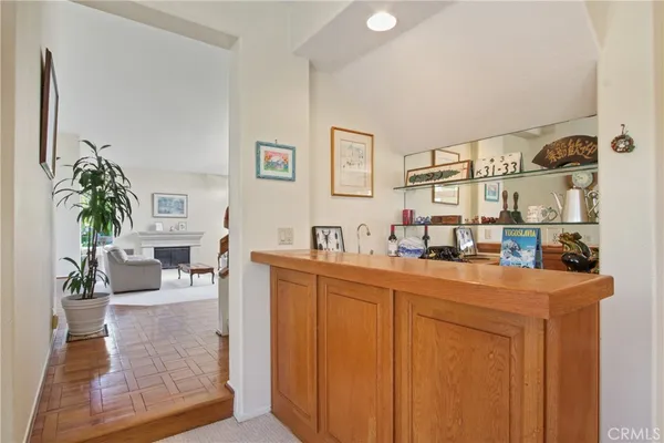a kitchen with sink a refrigerator and cabinets