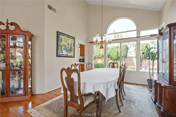 a view of a dining room with furniture window and outside view