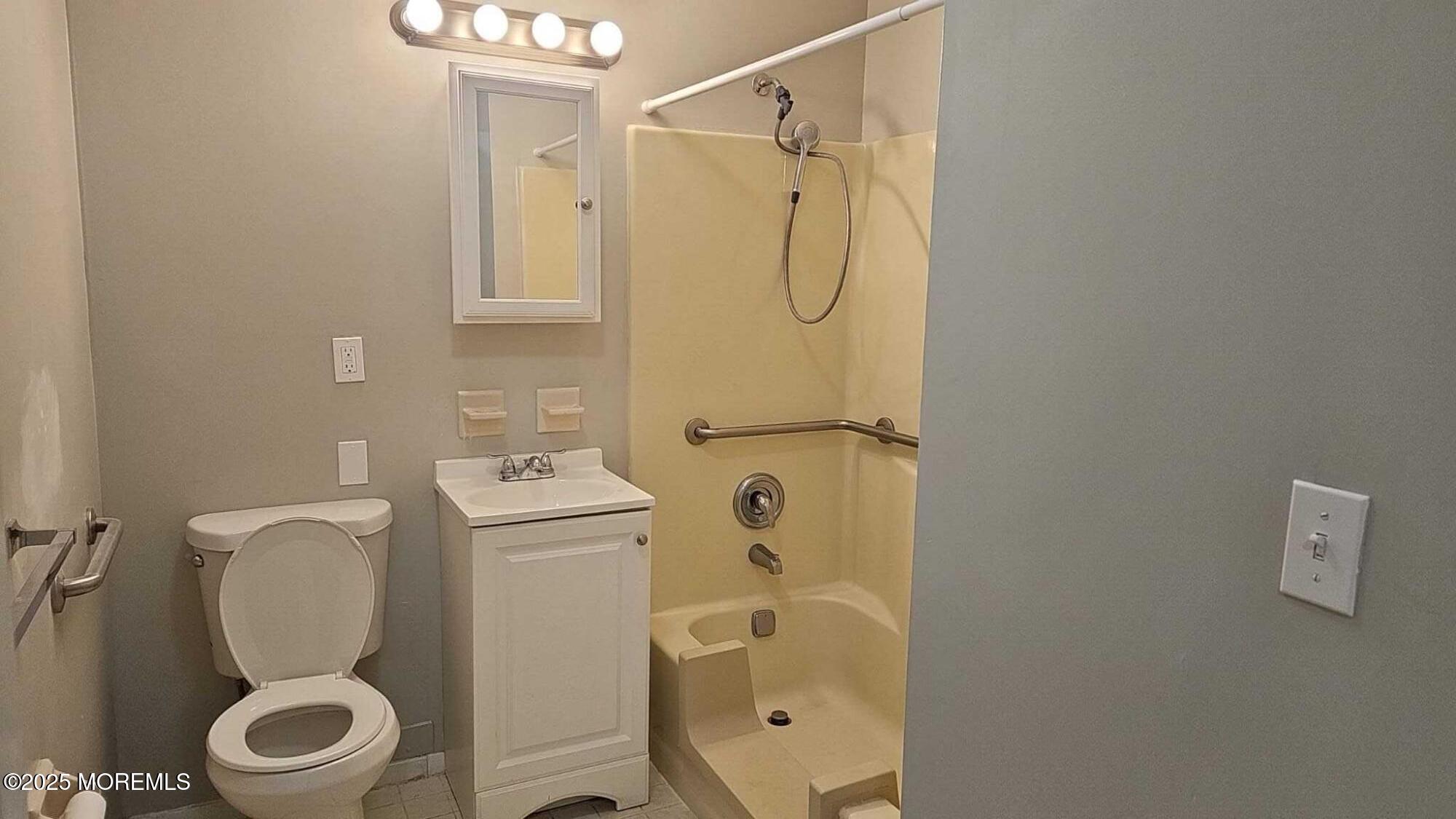1700 Highway 37, Unit 10206 Toms River, NJ 08757 - Photo 5 of 9 a bathroom with a toilet sink and shower