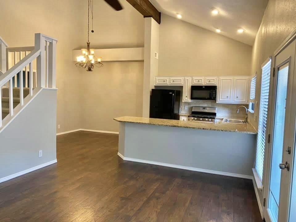 4404 Travis Country Circle, Unit G4 Austin, TX 78735 - Photo 9 of 15 Vast vaulted ceilings complement an inviting, open-concept living area and kitchen with sleek appliances.