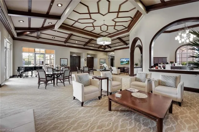 a living room with furniture and wooden floors