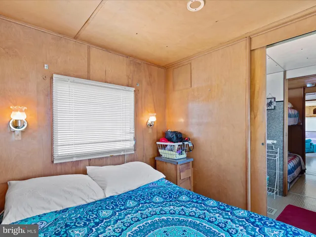 a bedroom with a bed and a closet