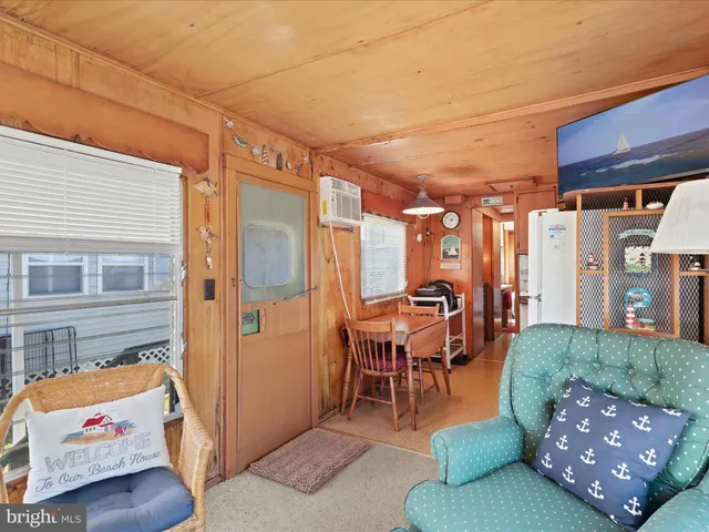 a backyard of a house with outdoor seating