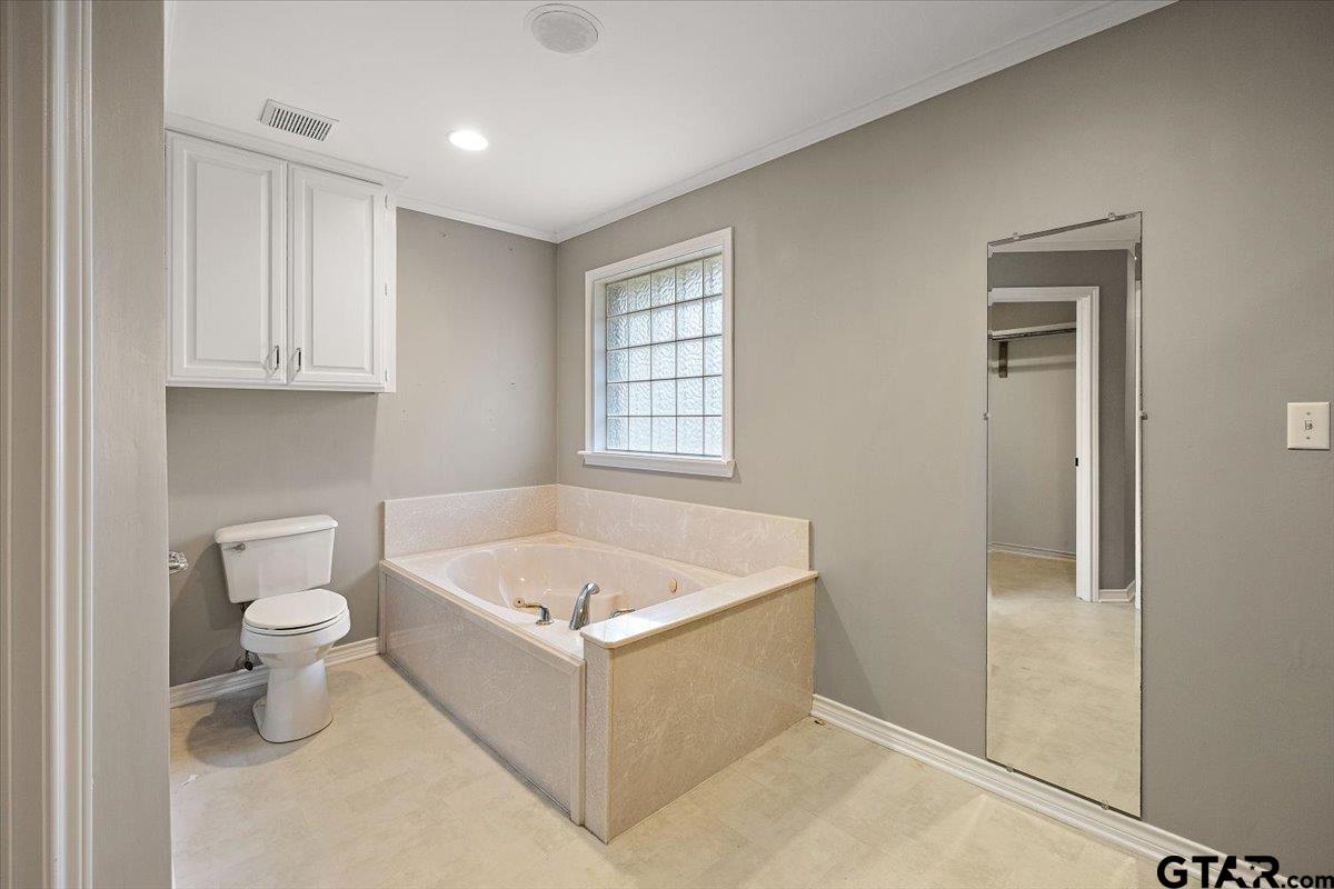 142 Parrish Rusk, TX 75785 - Photo 15 of 43 a white bath tub sitting next to a white toilet