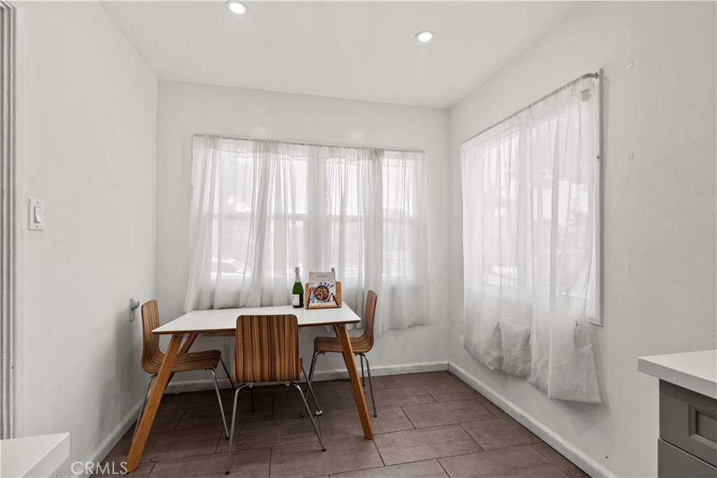 2725 East Tyler Street Carson, CA 90810 - Photo 17 of 30 a dining room with furniture and window