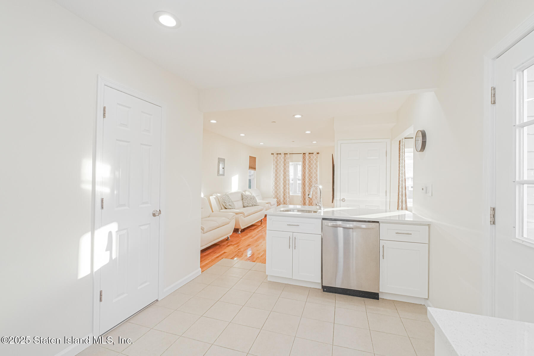 43 Maple Terrace Staten Island, NY 10306 - Photo 13 of 32 a large white kitchen with cabinets and a sink