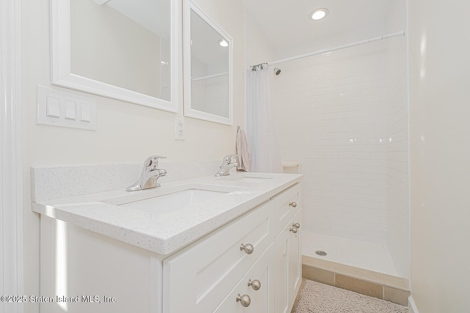 43 Maple Terrace Staten Island, NY 10306 - Photo 17 of 32 a bathroom with a sink and a mirror