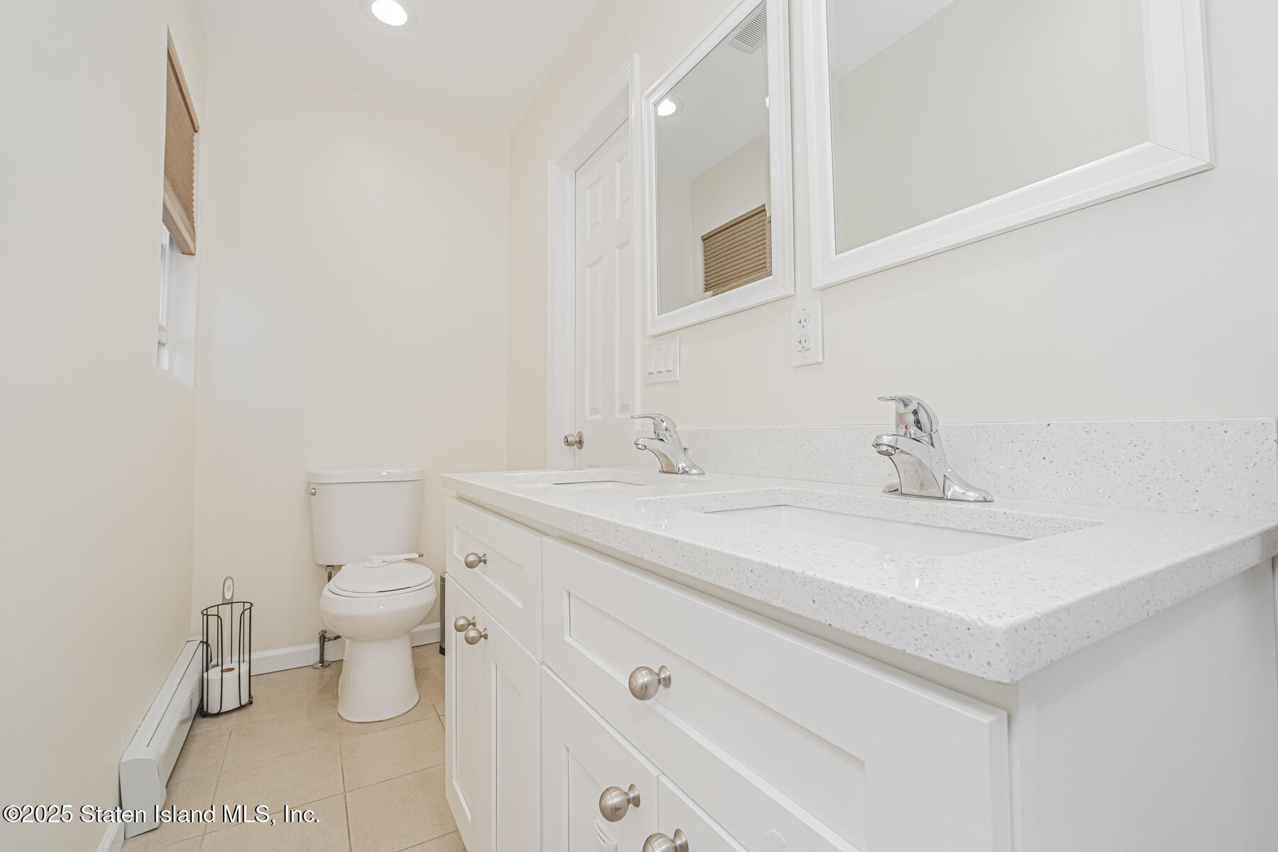 43 Maple Terrace Staten Island, NY 10306 - Photo 18 of 32 a bathroom with a sink toilet and vanity