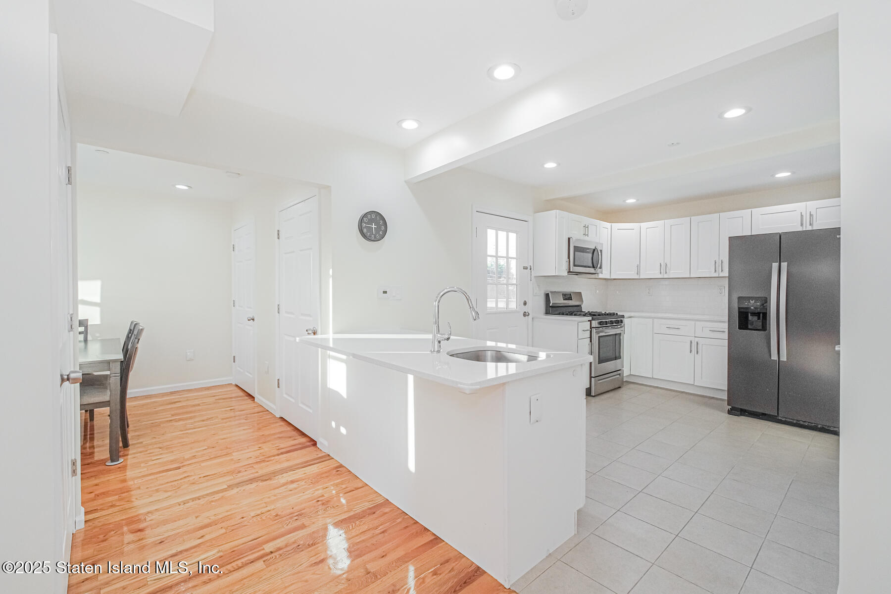 43 Maple Terrace Staten Island, NY 10306 - Photo 19 of 32 a kitchen with stainless steel appliances granite countertop a sink and cabinets