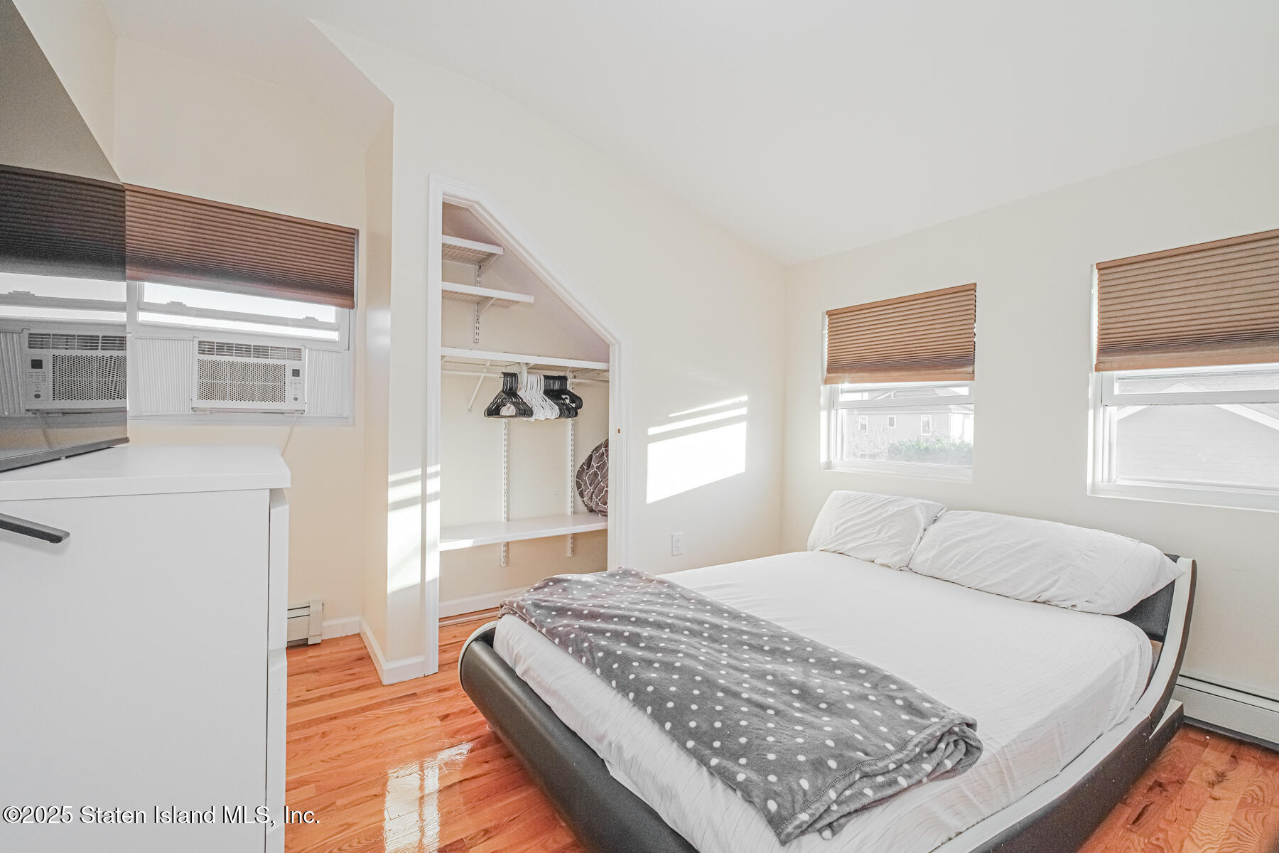 43 Maple Terrace Staten Island, NY 10306 - Photo 20 of 32 a bedroom with a bed and a window