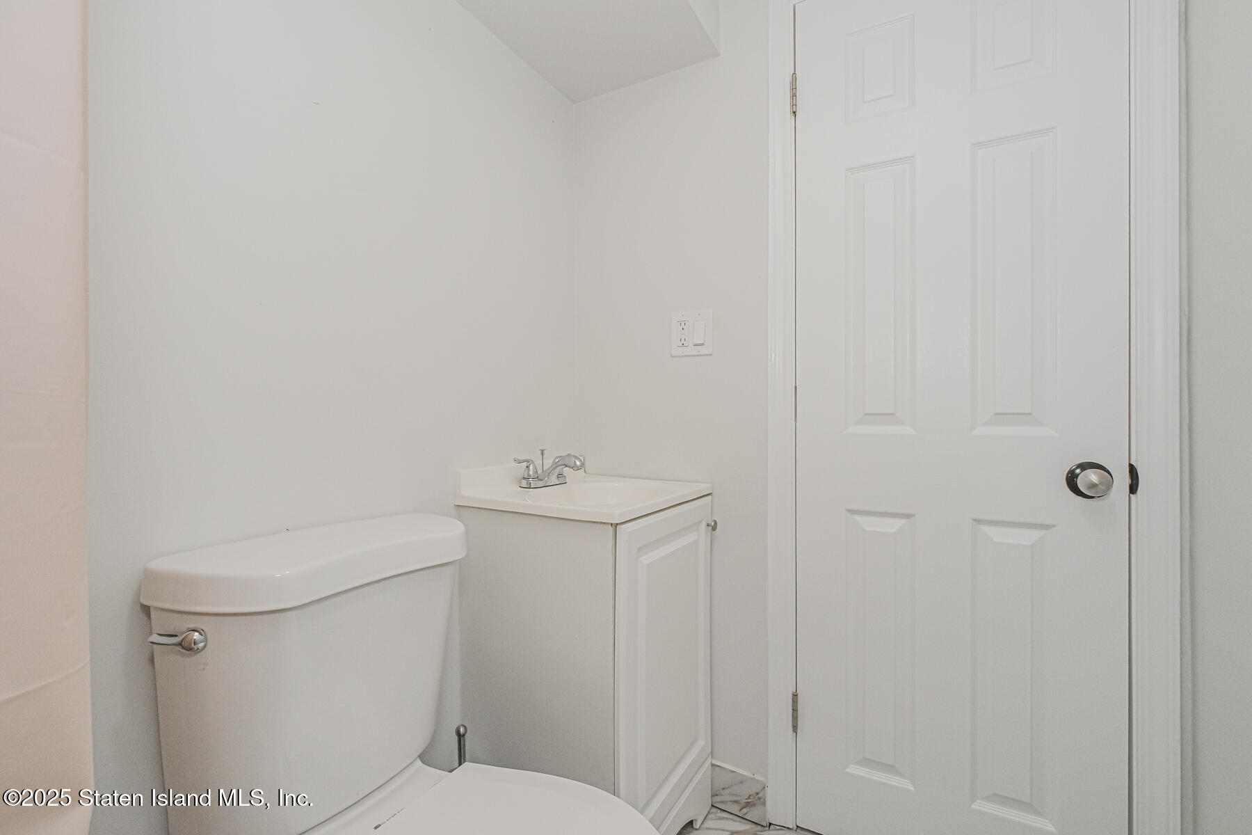 43 Maple Terrace Staten Island, NY 10306 - Photo 31 of 32 a white toilet sitting next to a shower