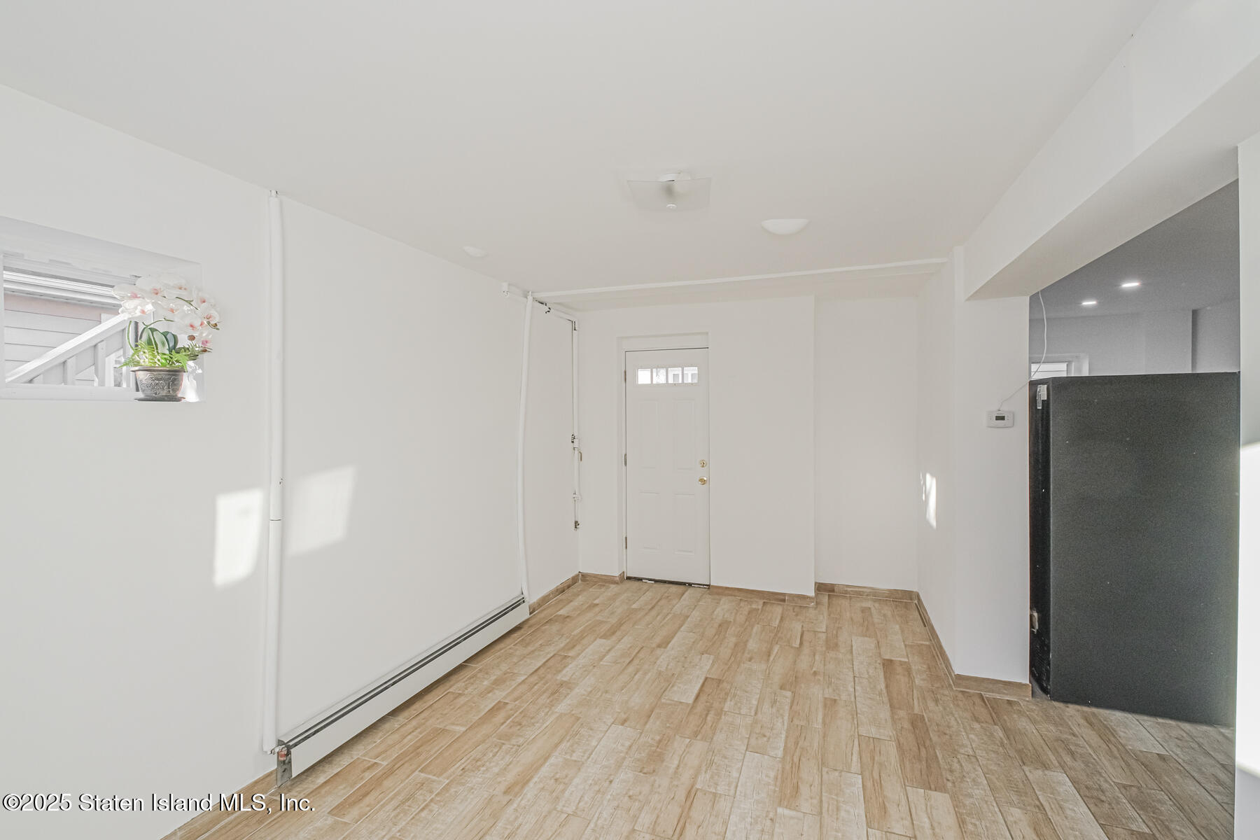 43 Maple Terrace Staten Island, NY 10306 - Photo 5 of 32 a view of empty room with wooden floor