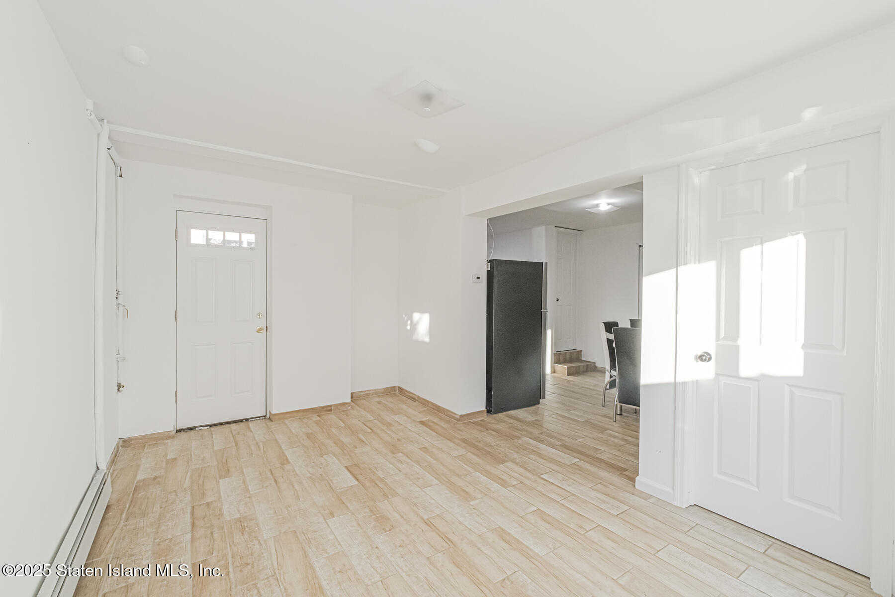 43 Maple Terrace Staten Island, NY 10306 - Photo 6 of 32 a view of an empty room with wooden floor