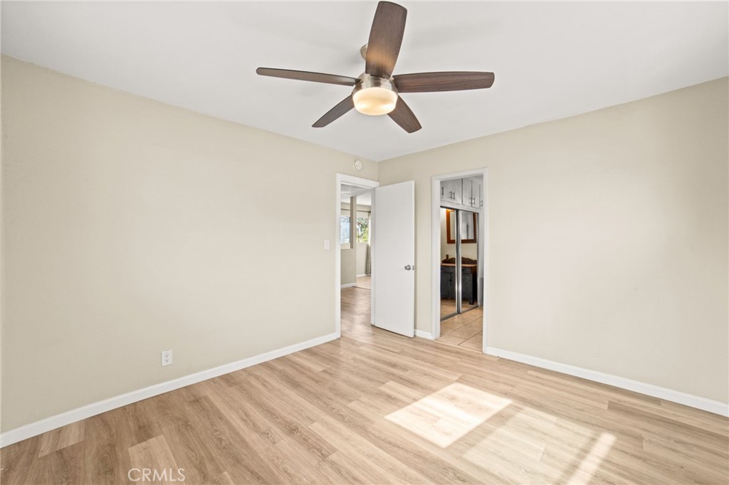 3717 Roosevelt Street Riverside, CA 92503 - Photo 22 of 23 a view of empty room with wooden floor and ceiling fan