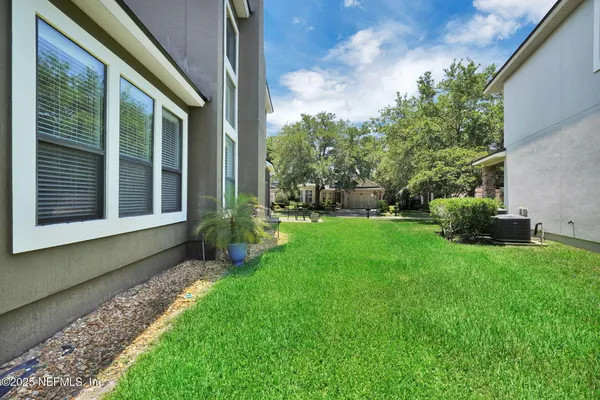a view of a back yard of the house