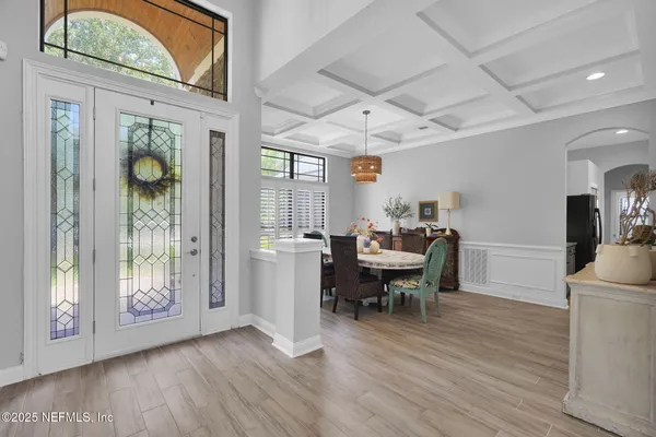 a view of a dining room with furniture window and wooden floor