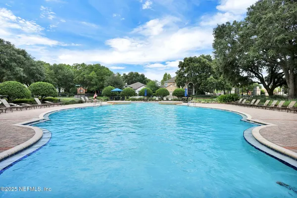 a view of a swimming pool and a yard